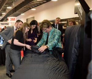 FELLFAB<sup>®</sup> Industrial Designer Lindsay Willcox shows The Honorable Diane Finely and CADSI President Christyn Cianfarani our new sleep system technology.