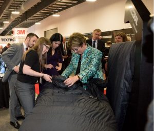 FELLFAB<sup>®</sup> Industrial Designer Lindsay Willcox shows The Honorable Diane Finely and CADSI President Christyn Cianfarani our new sleep system technology.